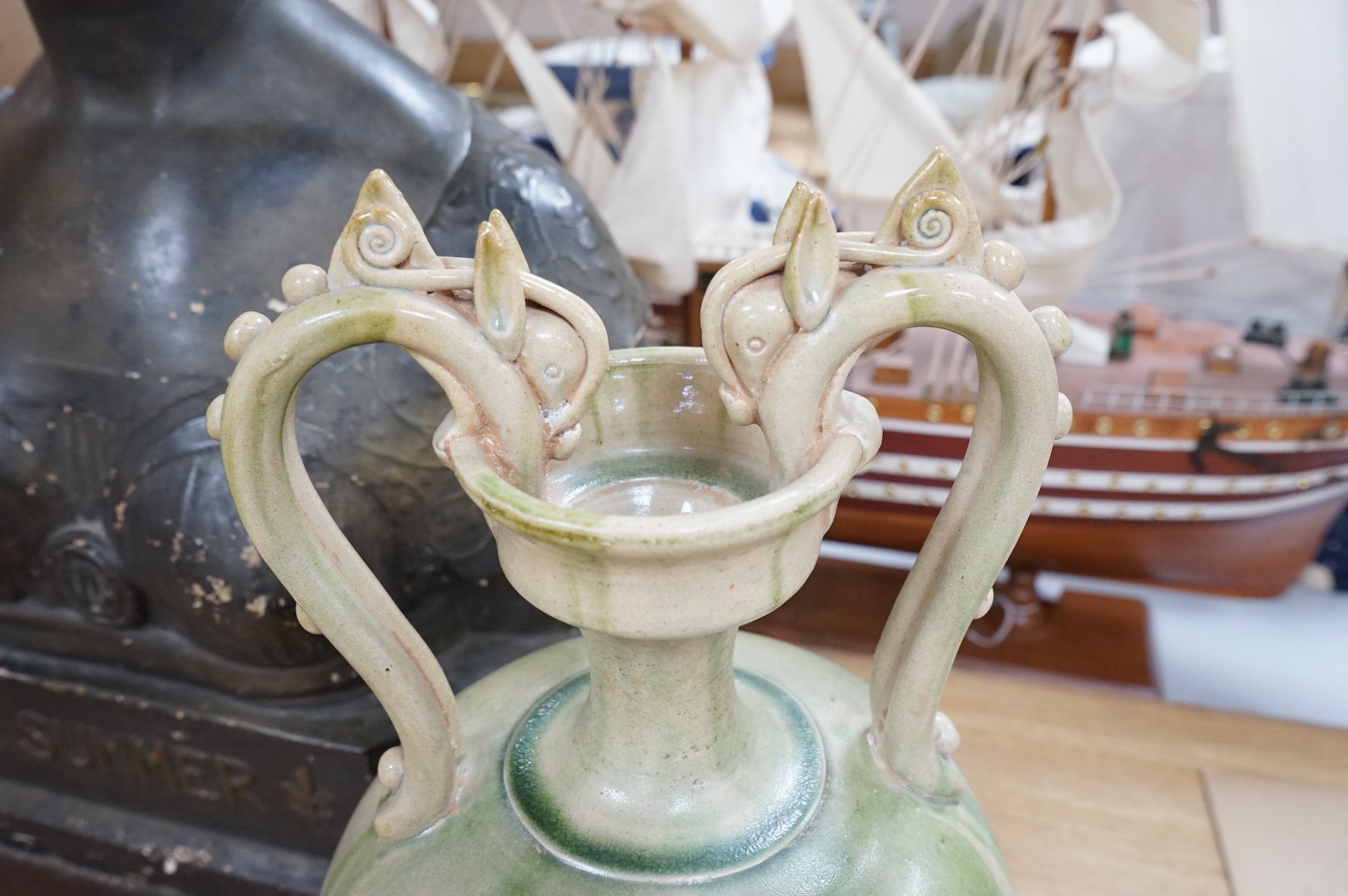 A Chinese green glazed terracotta ‘dragon’ handle vase, 42cm